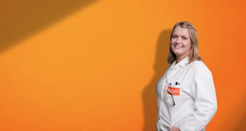 STOCKMEIER employee STOCKMEIER employee in front of orange background