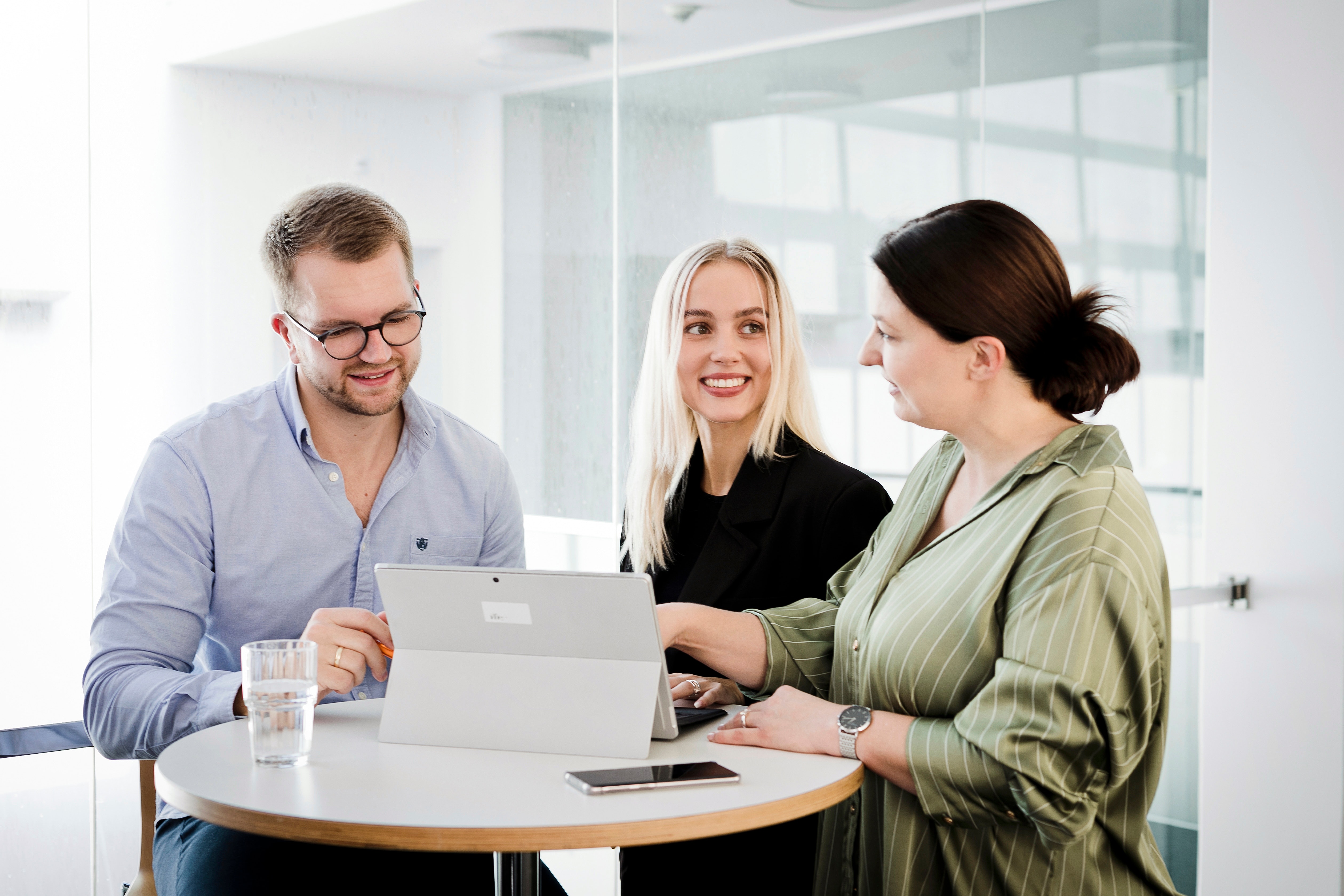 Three employees in a meeting