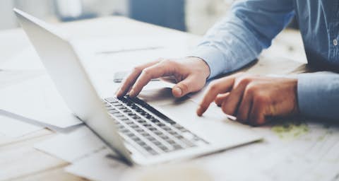 E-Billing Person working at a laptop