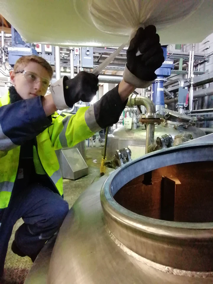 Leon Eser taking a sample at a mixing container