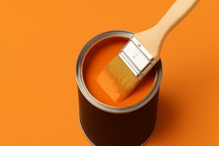 Orange paint bucket with brush Orange paint bucket with brush and orange paint