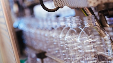 Contract Manufacturing Clos-up of bottles in a machine