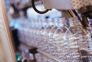 Contract Manufacturing Clos-up of bottles in a machine