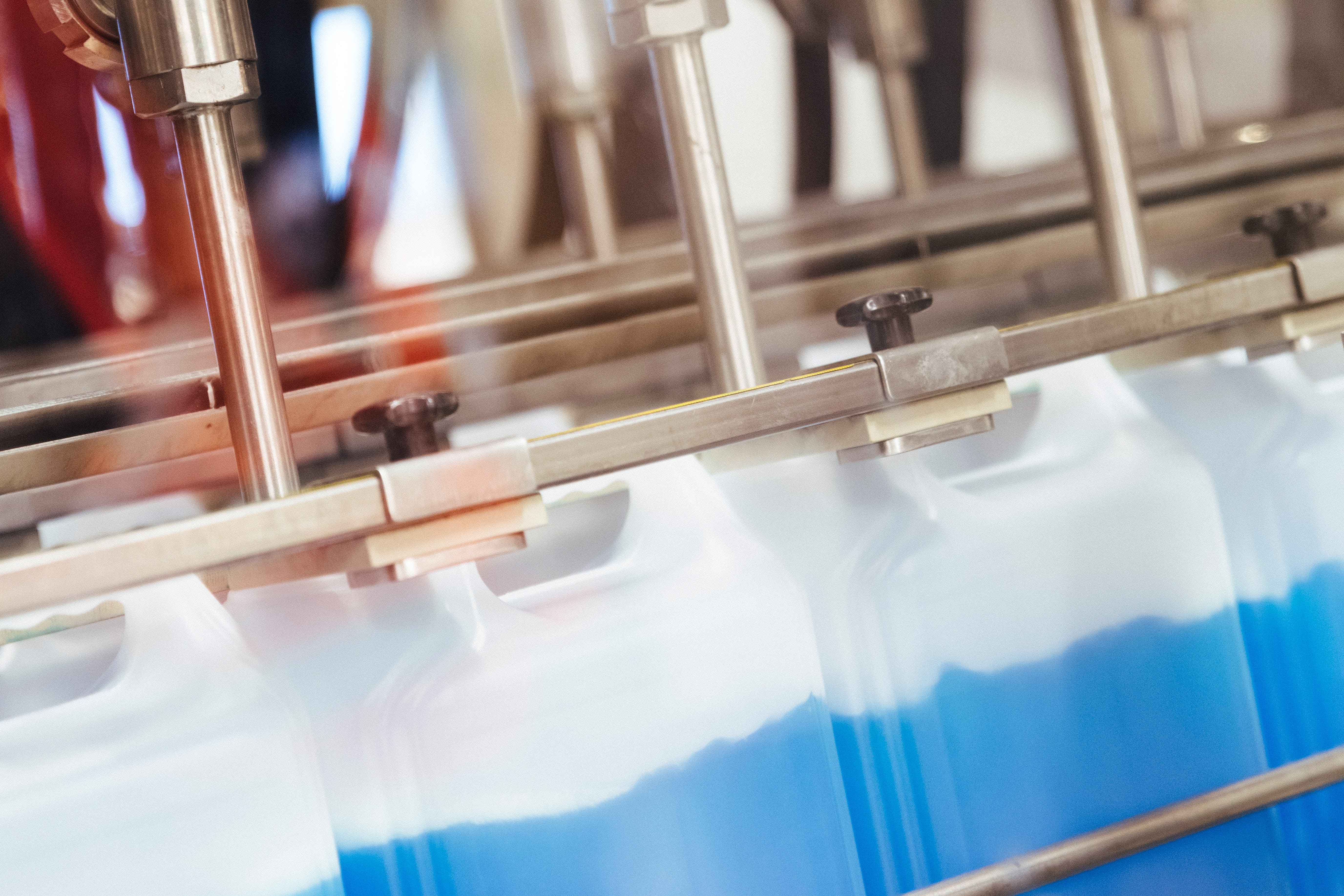 Contract Manufacturing Close-up of a machine filling cans