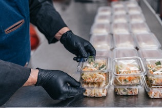 Salad is prepared in plastic lunch boxes. Salad is prepared in plastic lunch boxes.