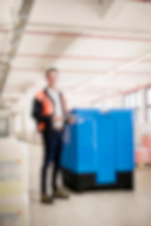 Varibox A man standing beside a Varibox