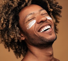 man with lotion on his face