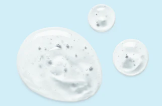 Three transparent bubbles of gel on a light blue background Three transparent bubbles of gel on a light blue background