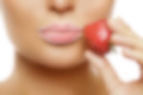 Lips and Strawberry Close-up of lips with sugar and a strawberry