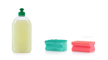 Set of cleaning products. Spray cleaner, WC cleaner, washing liquid, cream cleaner, sponge and roll of garbage bag isolated on white background Set of cleaning products. Spray cleaner, WC cleaner, washing liquid, cream cleaner, sponge and roll of garbage bag isolated on white background