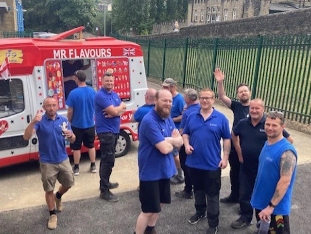 Employees of STOCKMEIER Urethanes getting a snack from "Mr. Flavours"